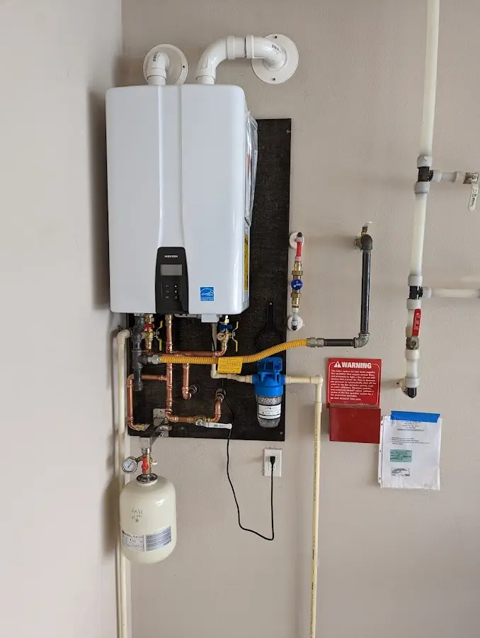 Professional plumber installing copper piping in a Eau Claire home