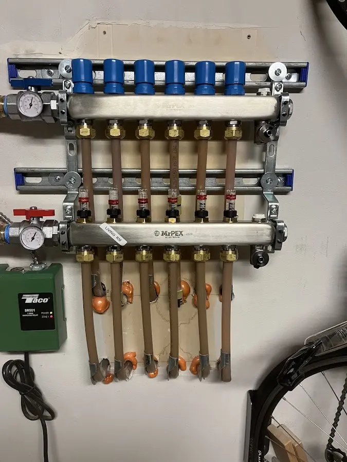 Plumber performing Water Heater Repair at a residential property in Eau Claire